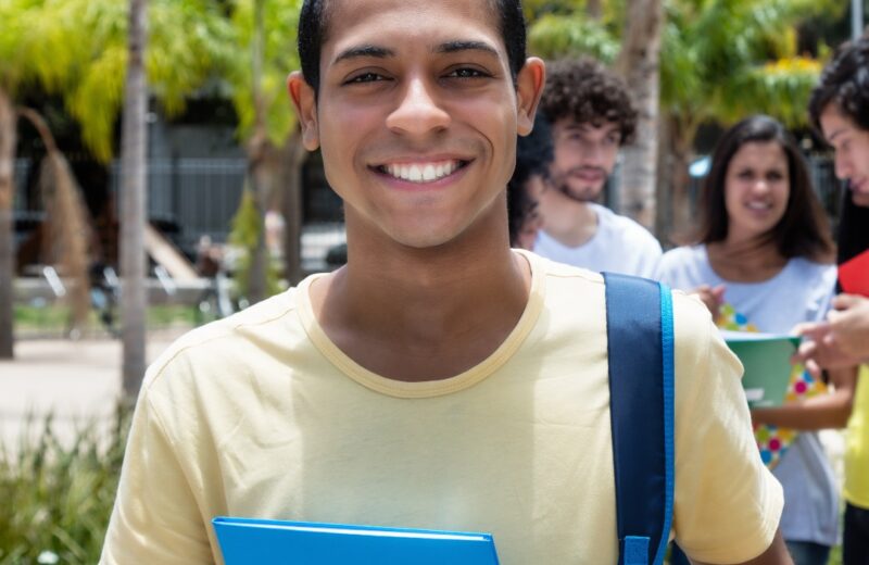 College student smiling outside