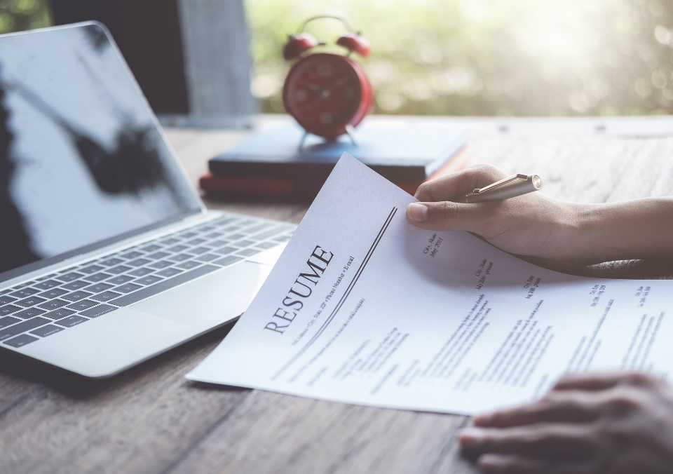 Someone reviewing a resume during an interview