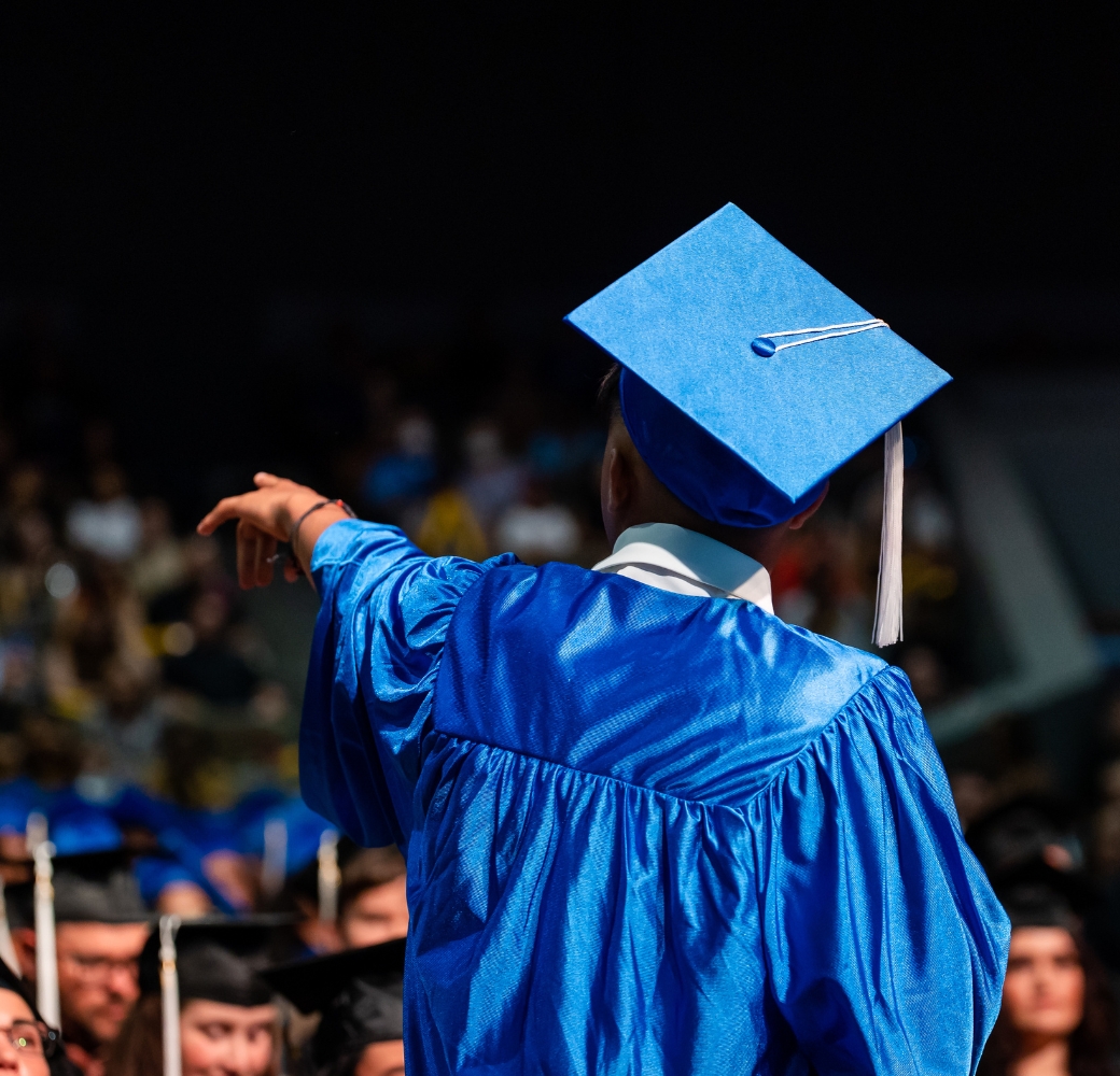 Student standing and speaking at his graduation ceremony