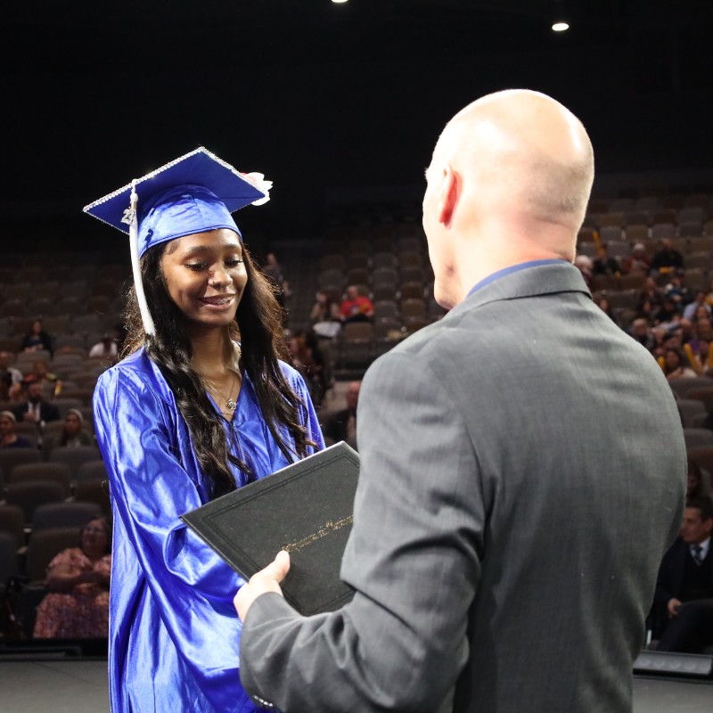 Graduate receiving her diploma