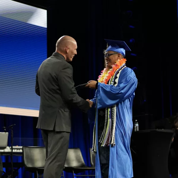 Graduate receiving their diploma