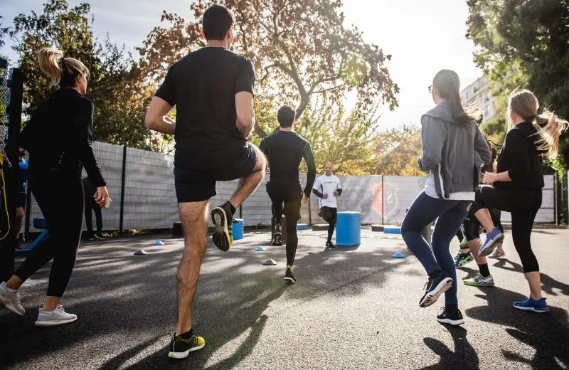 Group of people jogging in place, warming up before a workout