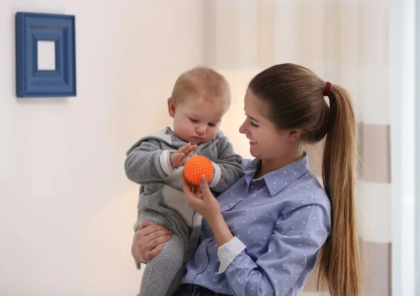 Teenager caring for a baby