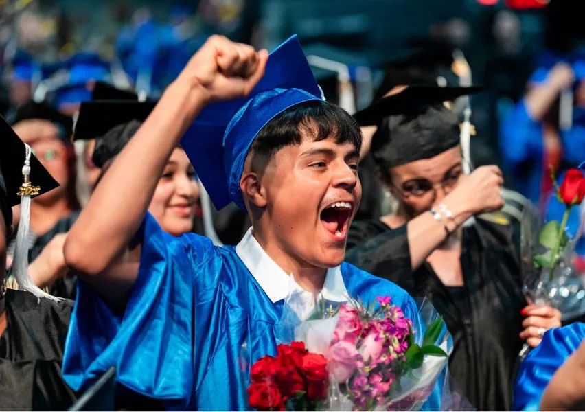 Graduate yells in celebration after earning his diploma