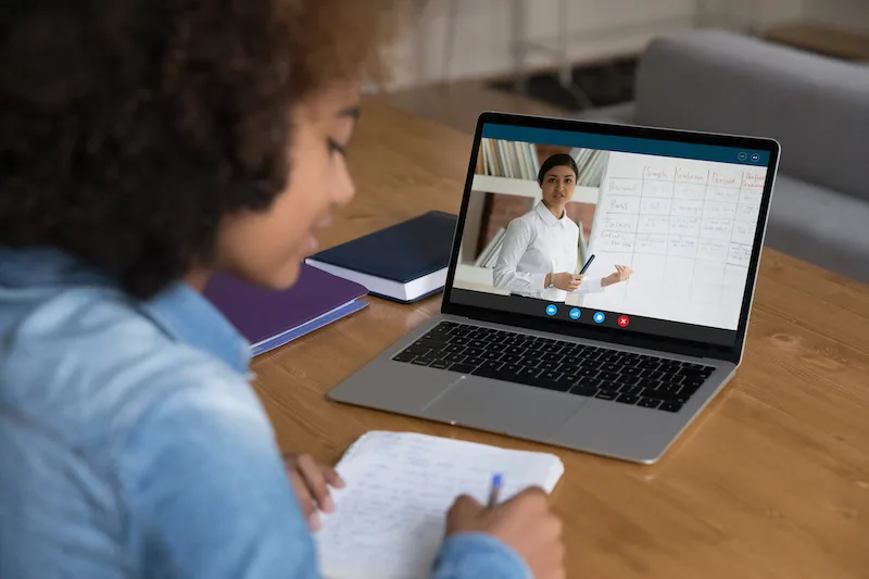 Student learning virtually on her computer