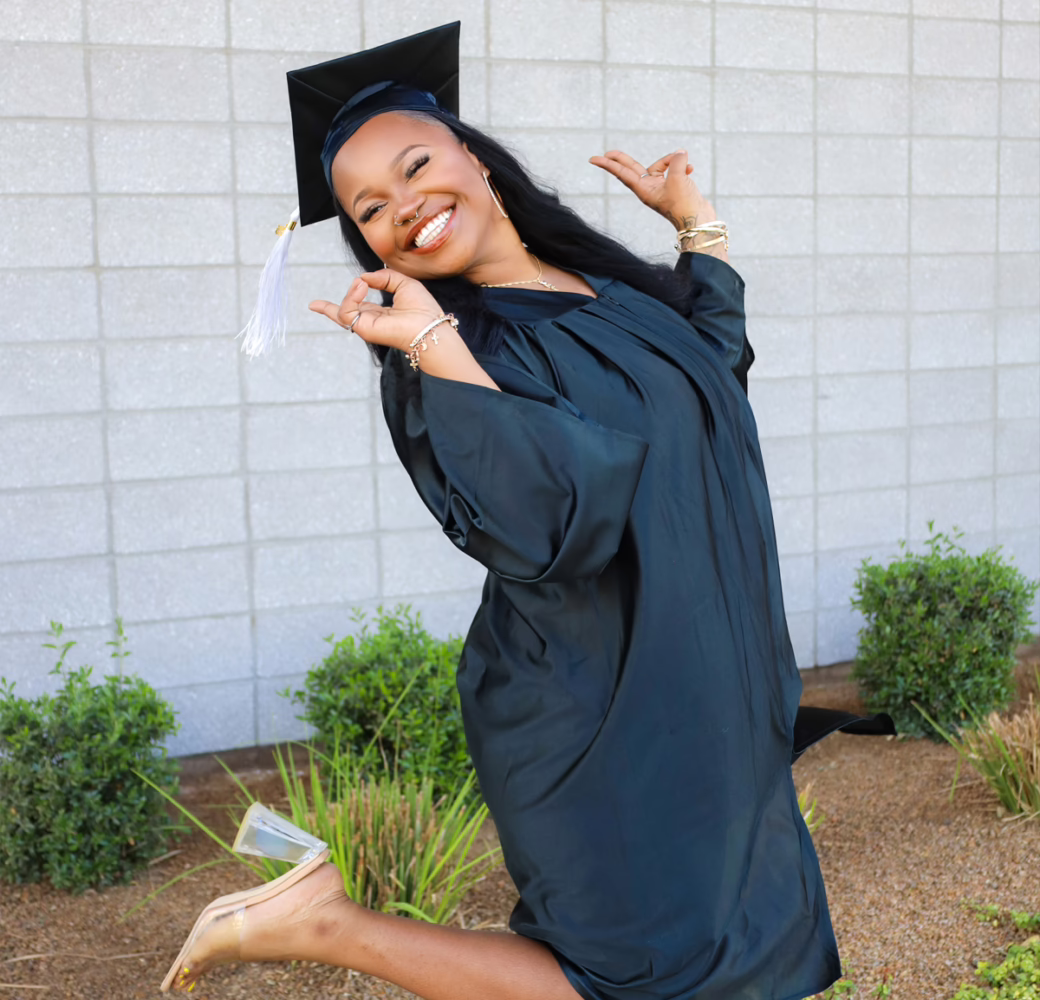 Smart Schools student celebrating their graduation in a cap and gown
